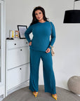 Two-piece set made from polyester and elastane, image of clothing with modern cut and comfortable design.