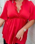 Satin blouse with lace, polyester and viscose, elegant women's garment with delicate details and luxurious look.