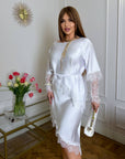 Asymmetrical lace blouse , модель от polyester, viscose и elastane, с елегантен дизайн и деликатни детайли.