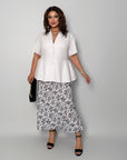 Conjunto falda y blusa con peplum