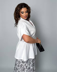 Conjunto falda y blusa con peplum