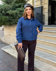 Cropped denim jacket made from cotton and polyester, model from Composition, with long sleeves and hood, suitable for everyday style.