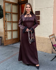 Long dress with a removable peplum belt made from polyester, viscose and elastane, model, suitable for elegant occasions.