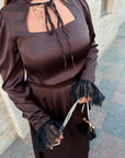 Long dress with a removable peplum belt made from polyester, viscose and elastane, image of fashionable women's model.