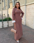 Long dress with a removable peplum belt made from polyester and elastane, model with elegant design and long sleeves.