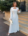 Long dress with a removable peplum belt, polyester, viscose and elastane, with an elegant design, image of a model.