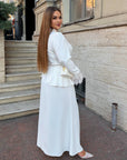 Long dress with a removable peplum belt made from polyester, viscose and elastane, with an elegant design and fine texture.