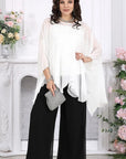 Elegant chiffon dress with a cape, branded from Composition 50% viscose and 50% polyester, image of a model.