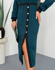 White fitted dress with a statement collar, made from polyester, viscose and spandex, visible in the image.