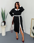 Fitted dress with a statement collar, made from polyester, viscose and spandex, model in the image.