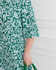 Crepe dress with ruffles  и lycra, брандирана от YR, изображена на модел, с polyester, nylon и lycra в дизайна.