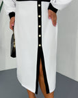 Stylish fitted dress with a statement collar, made from polyester, viscose and spandex, shown on a model.