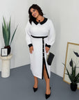 Women's fitted dress with a statement collar, made from polyester, viscose and spandex, on a model in the photo.