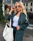 Suede bomber jacket and trouser set with polyester, viscose and elastane, in a fashionable style, shown in the image.