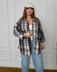Oversized checked shirt made from cotton and polyester, with large sleeves and classic design, suitable for everyday style.