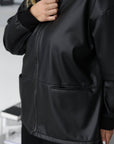 Faux-leather jacket in IT style, with 100% polyamide, model in the image, suitable for modern clothing.