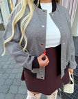Bomber jacket with rhinestones from IT, polyester and viscose, with details and design, shown in the photo.