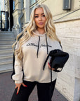 Suede tracksuit from IT with polyester, viscose and elastane, shown in the image.