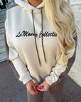 Suede tracksuit with polyester, viscose and elastane, image of elegant IT model against a white background.