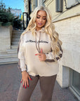 Suede tracksuit with polyester, viscose and elastane, image of elegant IT model in sporty style.