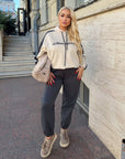 Sporty suede set IT with polyester, viscose and elastane, image of elegant model and details.