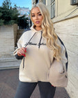 Suede tracksuit IT in neutral colours, composed of polyester, viscose and elastane, shown in the image.