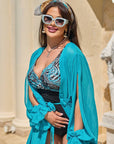 One-piece swimsuit от polyester, с цветен дизайн, подходящ за плуване и плаж.