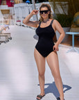 One-piece swimsuit with decorative elastic straps , направен от 100% polyester, с моден дизайн и цветни детайли.