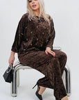Velvet dress with pearls, with viscose, cotton and elastane, elegant design, image of stylish women's dress.