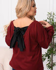 Velvet blouse with a bow
