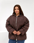 Lightweight hooded jacket made from polyester, suitable for autumn and winter, with a stylish design and comfortable cut.
