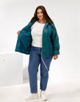 Lightweight hooded jacket made from polyester, model from Composition, shown in the image.