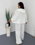Hooded knit set, white and grey, from soft cotton, polyester and elastane for comfort.