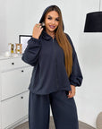 Hooded knit set made from cotton, polyester and elastane, suitable for comfort and style.