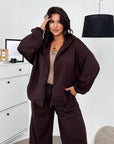 Hooded knit set made from cotton, polyester and elastane, suitable for comfort and style.