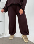 Hooded knit set made from cotton and polyester, model with stylish hood and comfortable design.