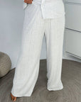Soft button-up pyjamas made from viscose and polyester, comfortable for sleeping and relaxation, shown in the image.