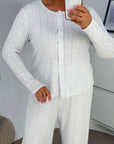 Soft button-up pyjamas made from viscose and polyester, comfortable for bedtime and relaxation, with delicate design.