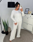 Soft button-up pyjamas made from viscose and polyester, comfortable for bedtime and relaxation.