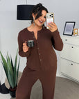 Soft button-up pyjamas made from viscose and polyester, comfortable for sleep, white in colour.