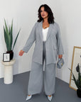 Striped business-style set with polyester, viscose and spandex, shown on a model, suitable for office and everyday look.