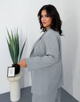 Striped business-style set, polyester, viscose and spandex, with an elegant design and modern look.