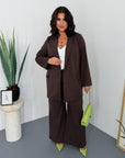 Striped business-style set with polyester and viscose, image of elegant business clothing.