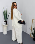 Striped business-style set with polyester, viscose and spandex, with simple design and elegant appearance.