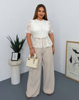 Lace blouse made from cotton and nylon, with delicate lace design, suitable for everyday style.