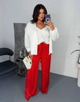Wide satin trousers with smooth texture and stretch, model made from polyester and elastane, with an elegant design.