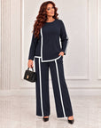 Blouse and trouser set made from polyester, viscose and lycra, model from fashion brand, shown in the image.