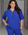 Set camicetta e pantaloni con bottoni