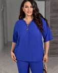 Set camicetta e pantaloni con bottoni