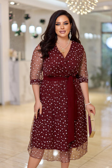 Avondjurk met glanzende mesh